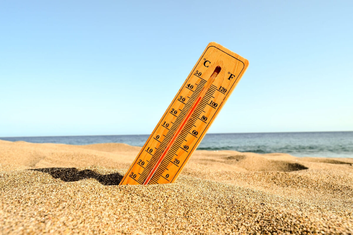 closeup-shot-thermometer-beach-sand