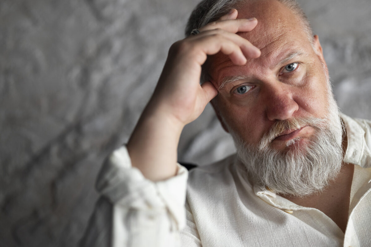 elegant-senior-man-posing-white-shirt