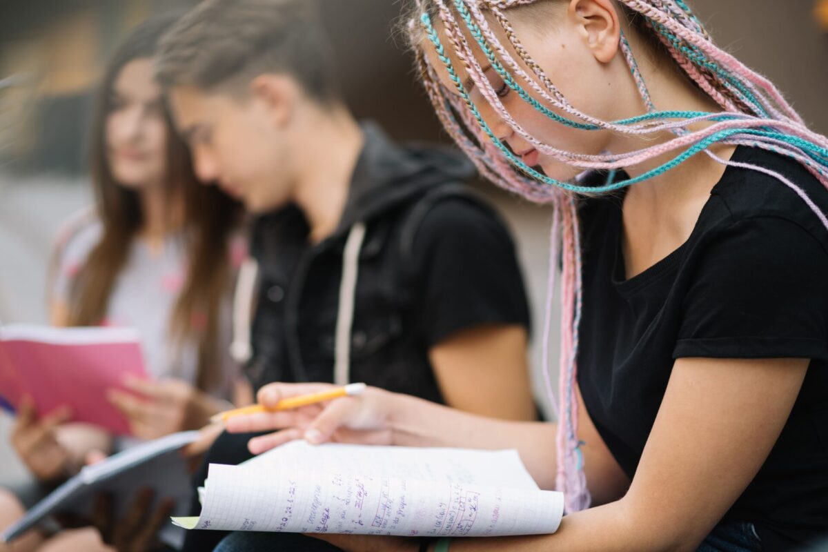 girl-with-friends-posing-with-books