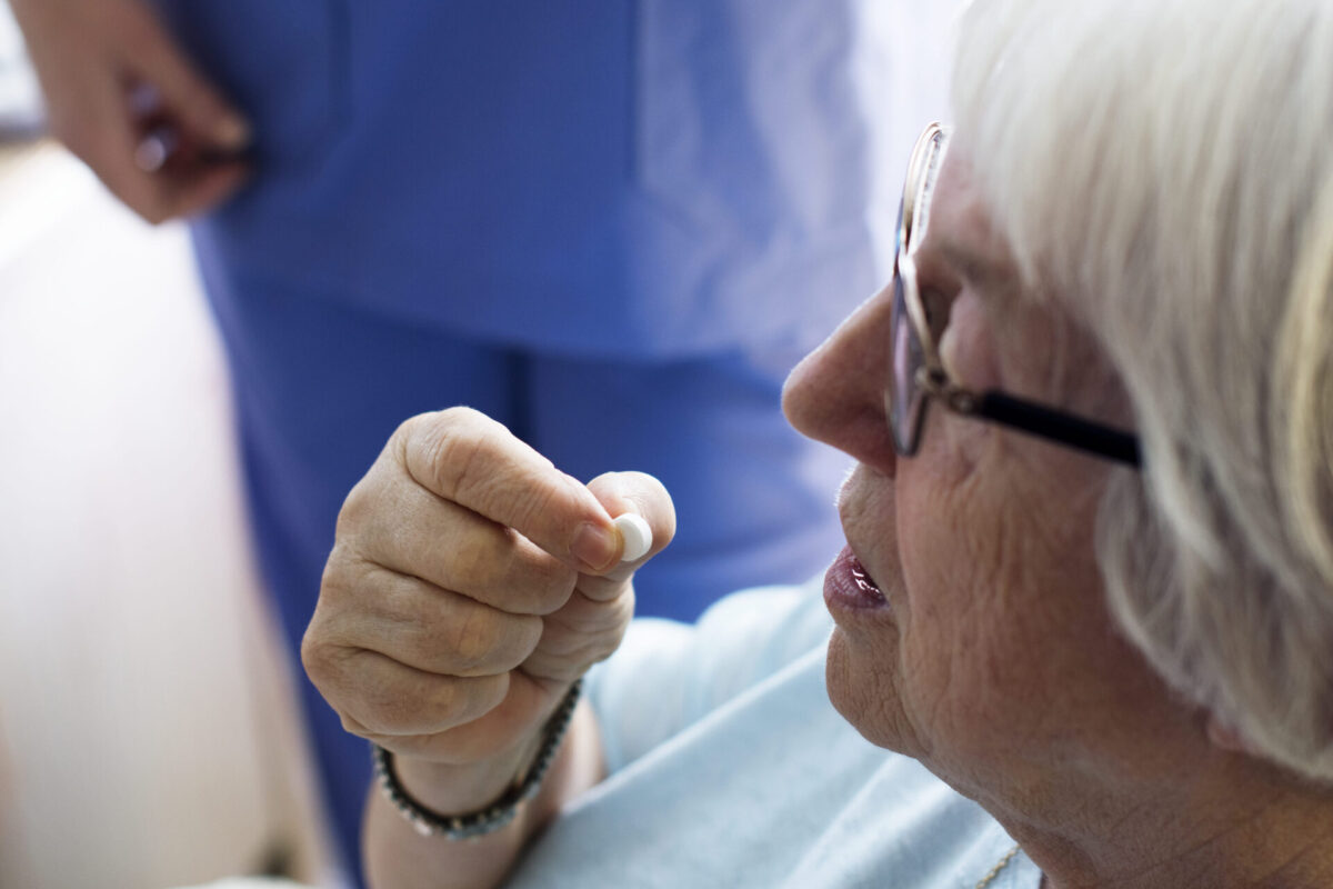 senior-woman-taking-medicine