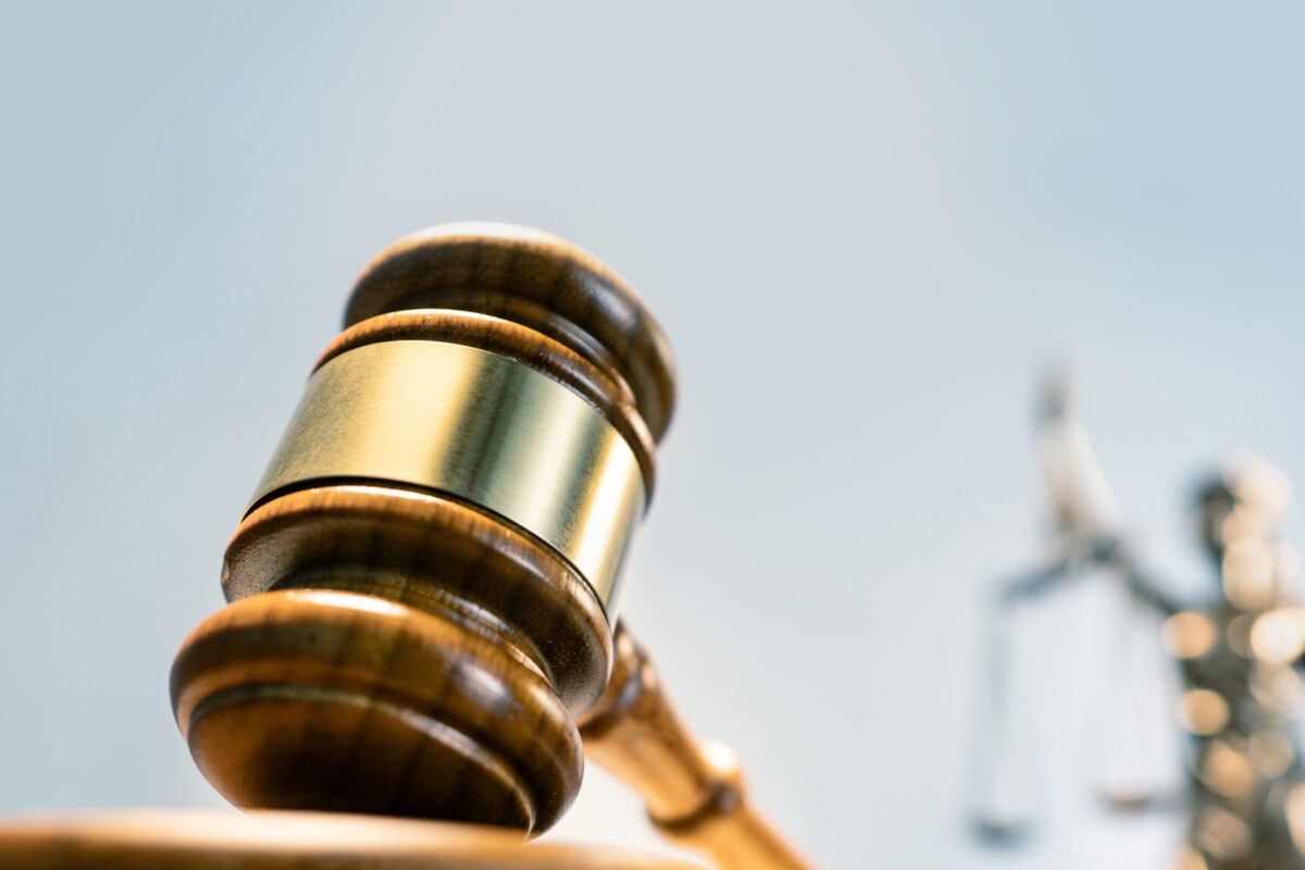 Statue of lady justice on bright background - Side view with copy space.